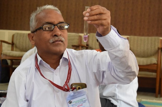 The solution changes its color because of titration